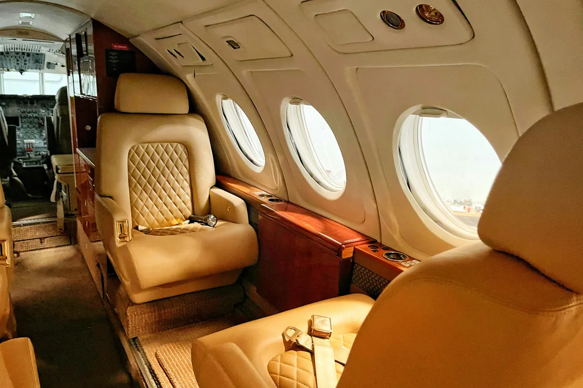 A warm leather cabin aboard a private jet